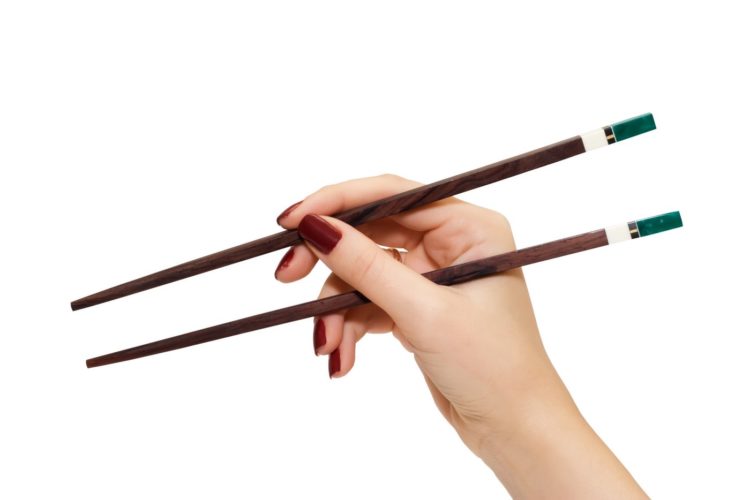 chopsticks in a hand