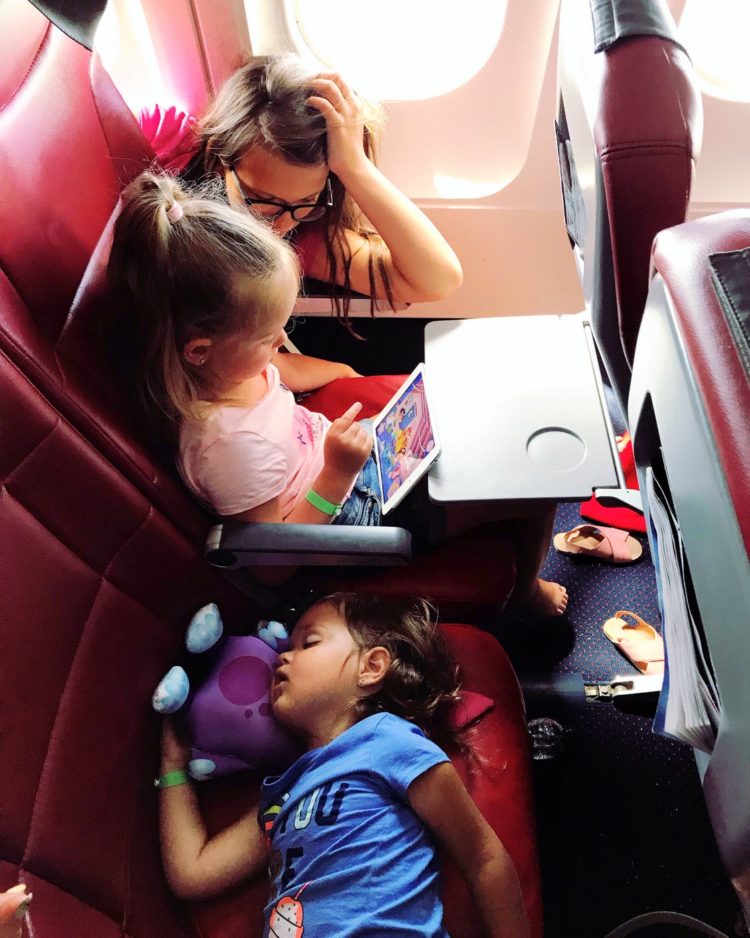 Kids sleeping on a long airplane flight