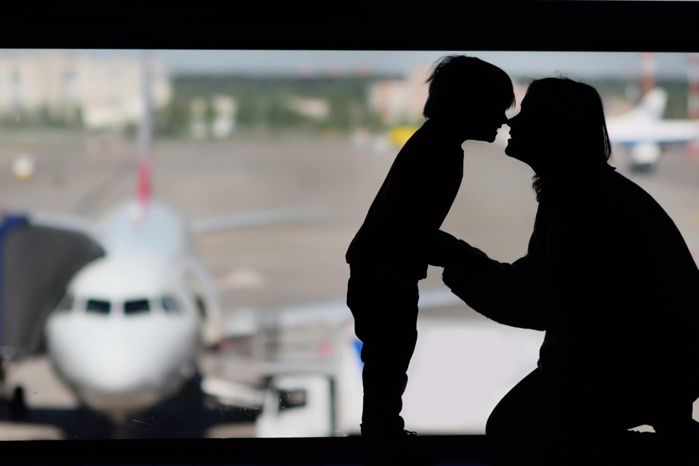 Mother and child in an airport