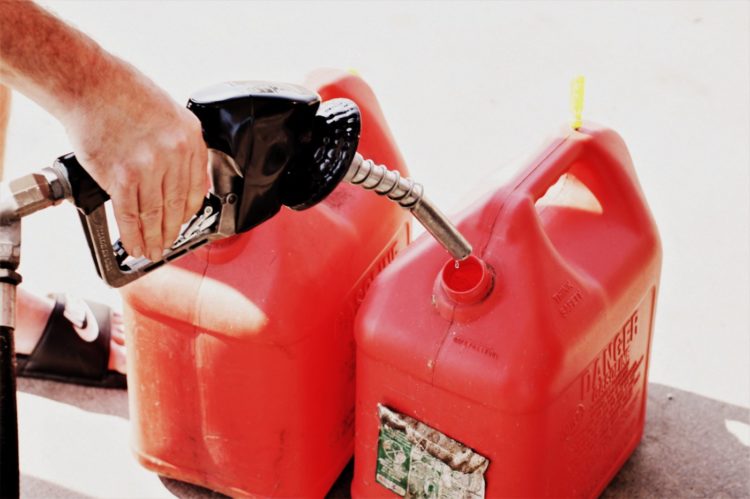 Filling red gas cans