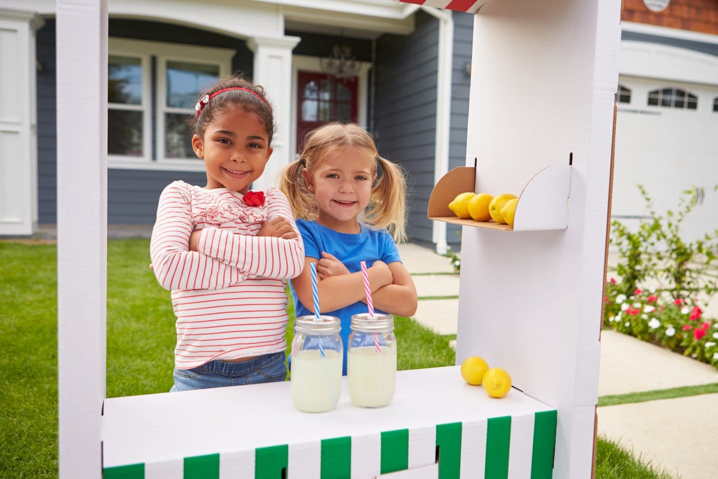 Two girls with a cute lemonade stand