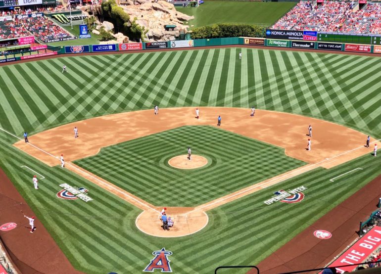 How do they make the grass stripes on major league baseball fields?