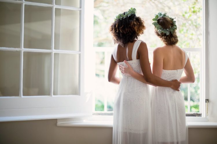 Two brides in inexpensive wedding dresses