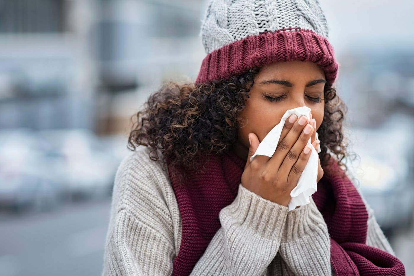 Woman sneezing