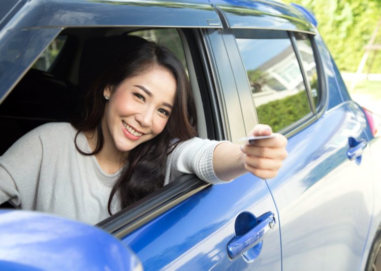 Woman happy to have a full-service gas station