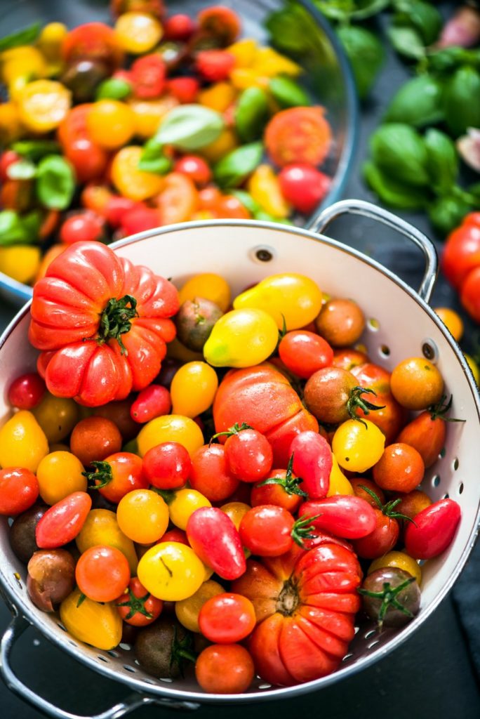 A variety of tomatoes - heirloom, grape, organic