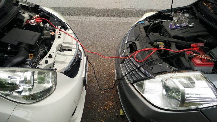 One car jump starting another car's battery