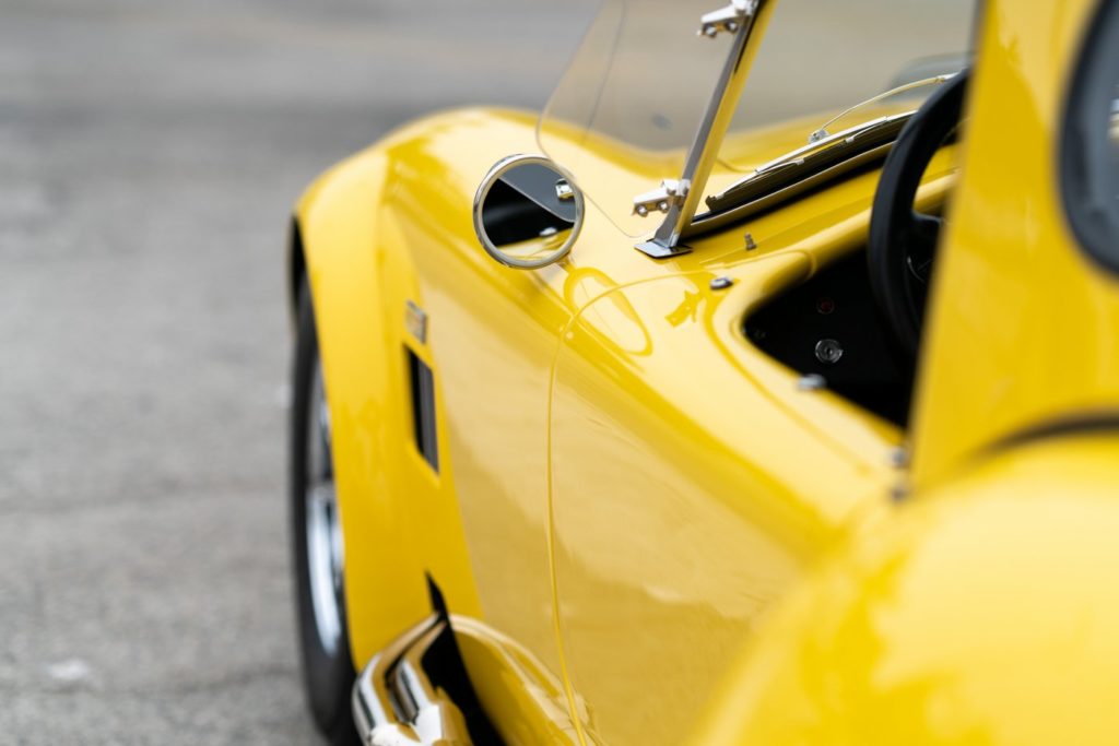 Shiny yellow waxed vintage sports car