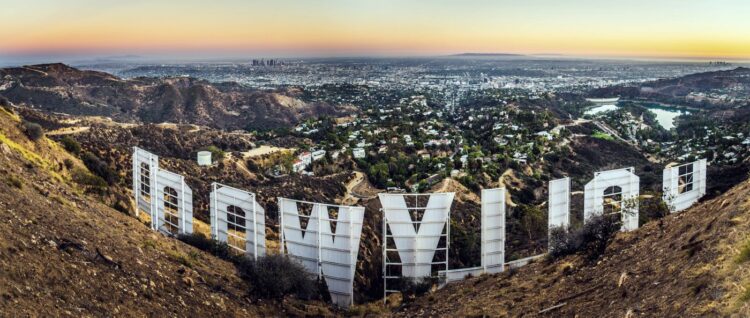 Famous HOLLYWOOD sign from behind and city of Los Angeles beyond